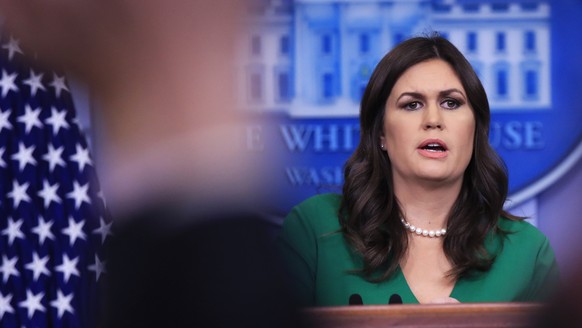 White House press secretary Sarah Huckabee Sanders talks to reporters during the daily press briefing in the Brady press briefing room at the White House, in Washington, Tuesday, Dec. 19, 2017. (AP Ph ...