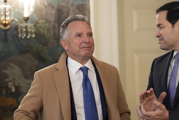 FILE - Steve Witkoff watches as Secretary of State Marco Rubio applauds as President Donald Trump, accompanied by Marc Fogel, speak in the Diplomatic Reception Room at the White House, Feb. 11, 2025,  ...