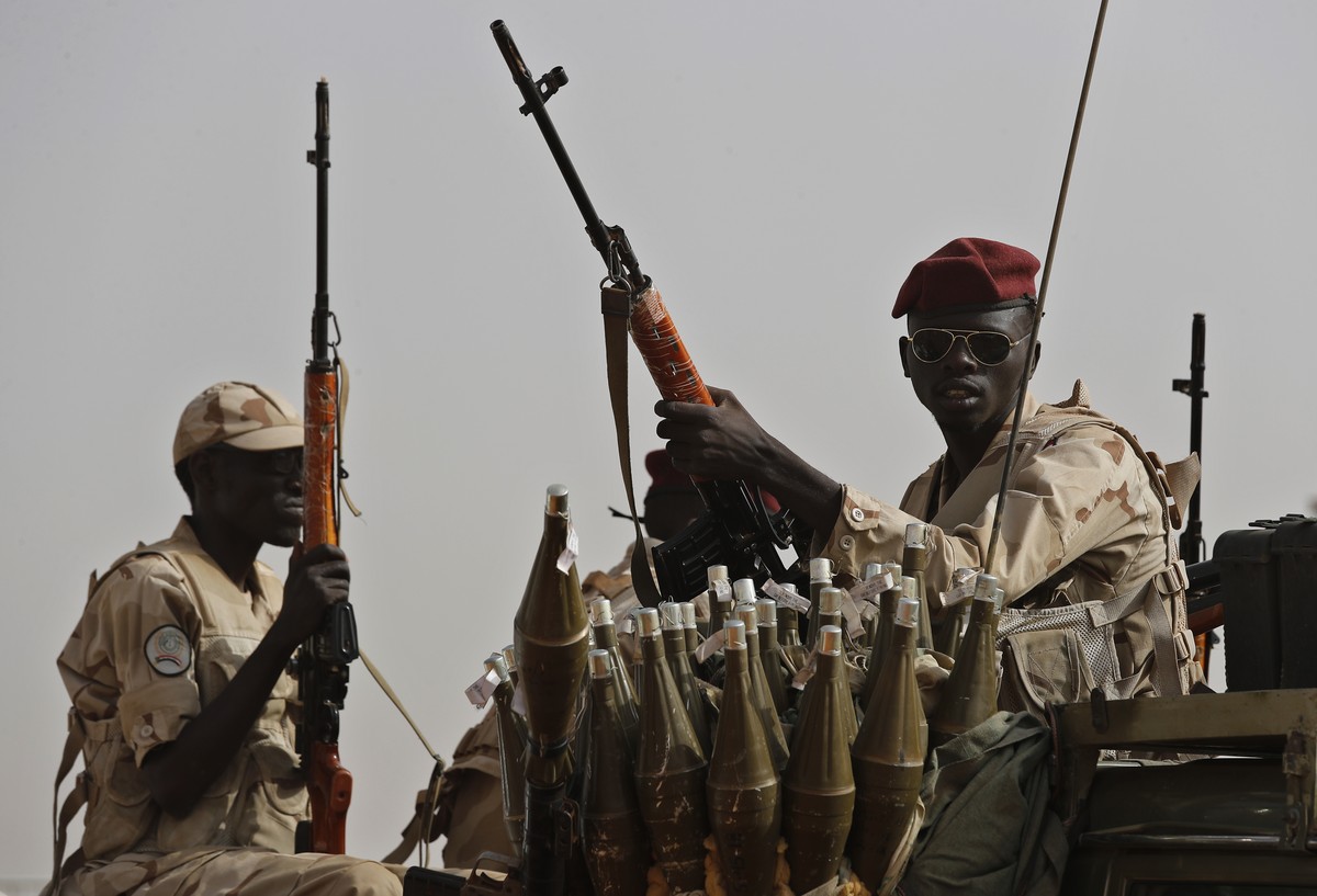 FILE - Sudanese soldiers from the Rapid Support Forces unit, led by Gen. Mohammed Hamdan Dagalo, the deputy head of the military council, secure the area where Dagalo attends a military-backed tribe&# ...