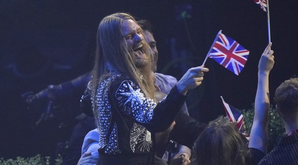 Sam Ryder from United Kingdom reacts during the Grand Final of the Eurovision Song Contest at Palaolimpico arena, in Turin, Italy, Saturday, May 14, 2022. (AP Photo/Luca Bruno)