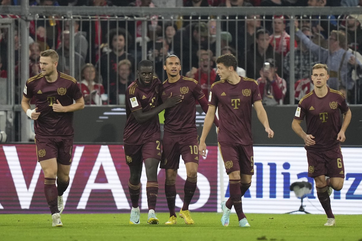Bayern's Leroy Sane, center, celebrates with teammates after scoring during the German Bundesliga soccer match between FC Bayern Munich and Bayer 04 Leverkusen at the Allianz Arena in Munich, Ger ...