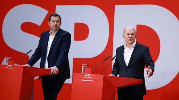 epa11921191 German Chancellor Olaf Scholz (R) and Social Democratic Party (SPD) co-chairman Lars Klingbeil attend the Social Democratic Party (SPD) press conference at the Social Democrats headquarter ...