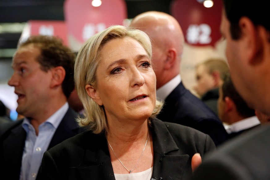 Marine Le Pen (C), French National Front (FN) political party leader and candidate for French 2017 presidential election, visits the Salon des Entrepreneurs (Entrepreneurship fair) in Paris, France, F ...