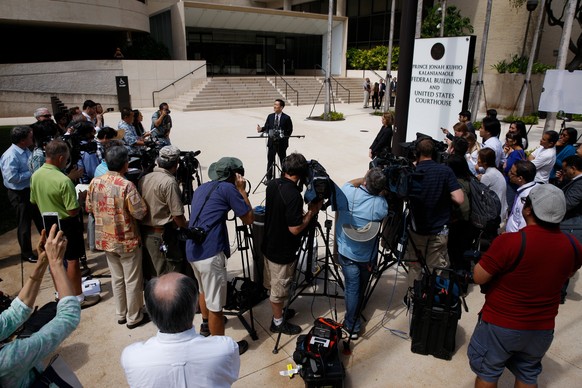 epa05850937 Hawaii Attorney General Douglas Chin answers questions from the press in front of the US District Courthouse in Honolulu, Hawaii, USA 15 March, 2017. Hawaii Attorney General Douglas Chin m ...