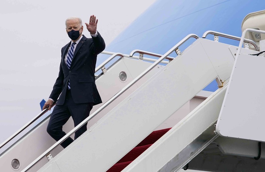 President Joe Biden waves as he arrives on Air Force One, Tuesday March 16, 2021, at Philadelphia International Airport in Philadelphia, Pa. President Biden says New York Gov. Andrew Cuomo should resi ...