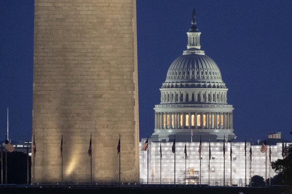 epa10638533 The US Capitol Building and Washington Monument, as seen from the Lincoln Memorial Reflecting Pool before dawn on the National Mall in Washington, DC, USA, 19 May 2023. US Treasury Secreta ...