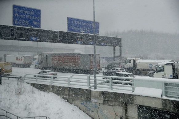 Vehicles crawl along a road as snow falls in south east England, as seen through the window of a train travelling from London to Canterbury, England, Tuesday, Feb. 27, 2018. The so-called &quot;Beast from the East&quot; snow storm arrived in the Britain Monday and is predicted to continue for the next few days as it chills most of Europe. (AP Photo/Matt Dunham)
