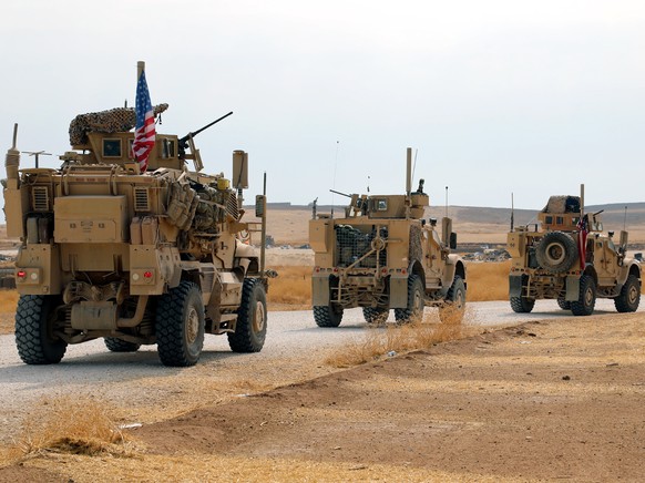 epa07936944 A convoy of US troops head toward the Iraqi borders in northeastern of Syria, 20 October 2019. Media reported the US troops started their withdrawal from north Syria towards Iraq according ...