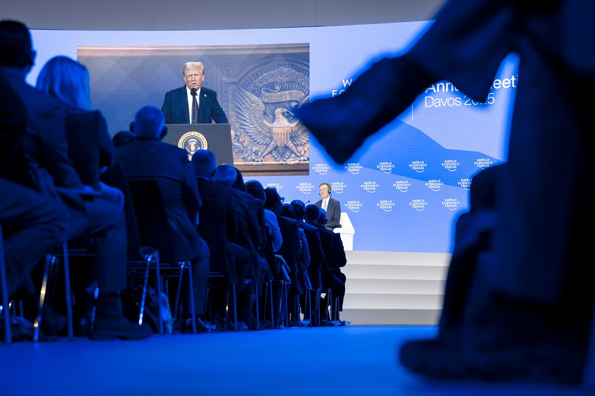epaselect epa11847640 US President Donald J. Trump appears on a screen as he addresses via videolink a plenary session during the 55th annual meeting of the World Economic Forum (WEF) in Davos, Switze ...