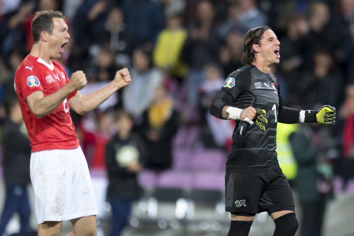 Switzerland's defender Stephan Lichtsteiner, left, and Switzerland's goalkeeper Yann Sommer. right, celebrate the victory after the UEFA Euro 2020 qualifying Group D soccer match between Swi ...