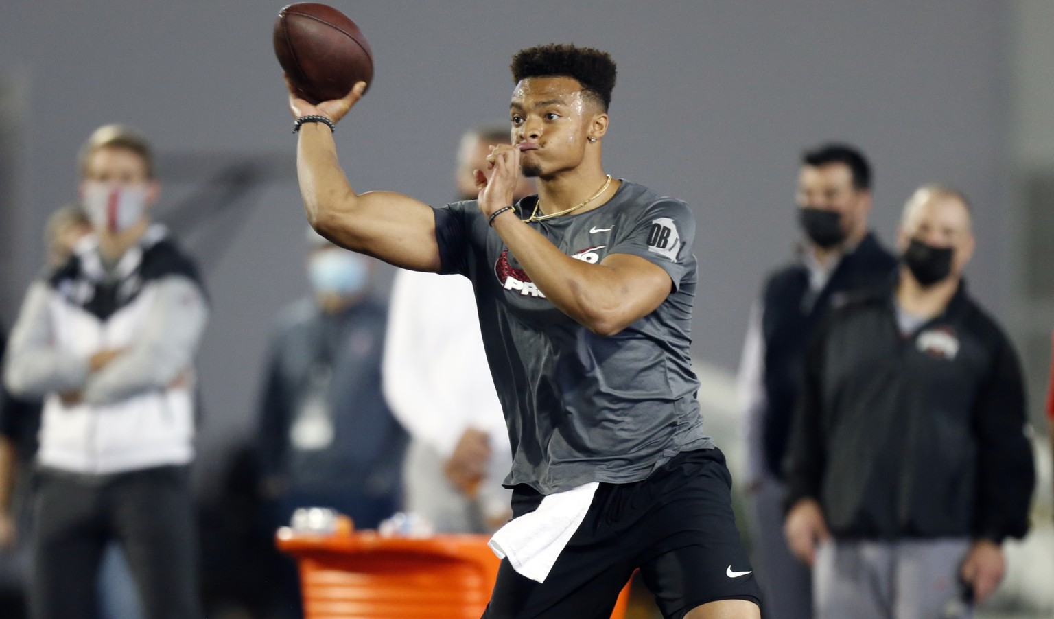 Quarterback Justin Fields throws as part of a drill during an NFL Pro Day at Ohio State University, Tuesday, March 30, 2021, in Columbus, Ohio. (AP Photo/Paul Vernon)