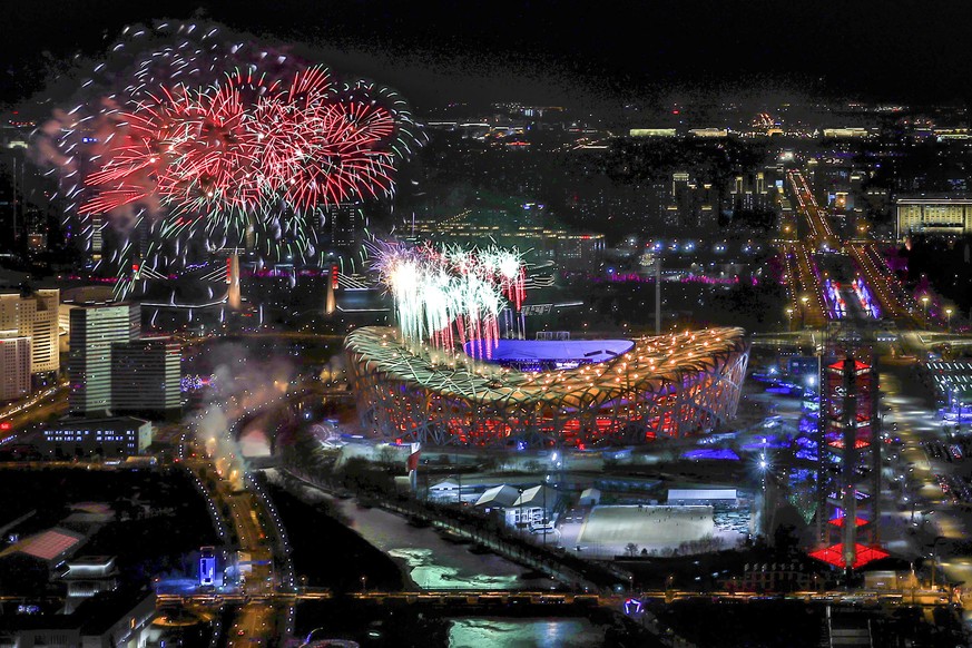 In this photo released by Xinhua News Agency, fireworks illuminate the night sky during the closing ceremony of the 2022 Winter Games at the iconic Bird&#039;s Nest National Stadium in Beijing on Sund ...