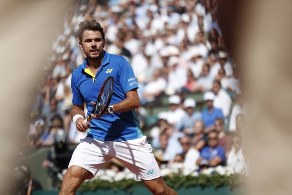 Switzerland&#039;s Stan Wawrinka watches the ball in his fourth round match of the French Open tennis tournament against France&#039;s Gael Monfils at the Roland Garros stadium, in Paris, France. Mond ...