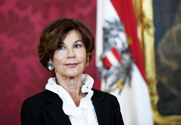 epa07612475 Brigitte Bierlein, president of the Austrian constitutional court, looks on during a press conference with Austrian President Alexander van der Bellen at the Hofburg Palace in Vienna, Aust ...