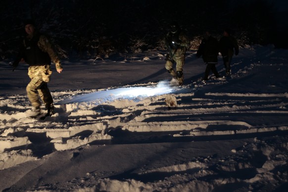 Bosnian police return from chasing a suspected serial killer in the village of Medvjedice 30 kms south of Sarajevo, Bosnia, Tuesday, Feb. 12, 2019. Bosnia police on Tuesday shot and killed the country ...