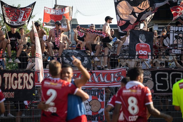 FC Sion Fans celebrates the victory to end the Super League soccer match FC Lugano against FC Sion at the Cornaredo stadium in Lugano, Sunday, July 17, 2022. (KEYSTONE/Ti-Press/Massimo Piccoli)