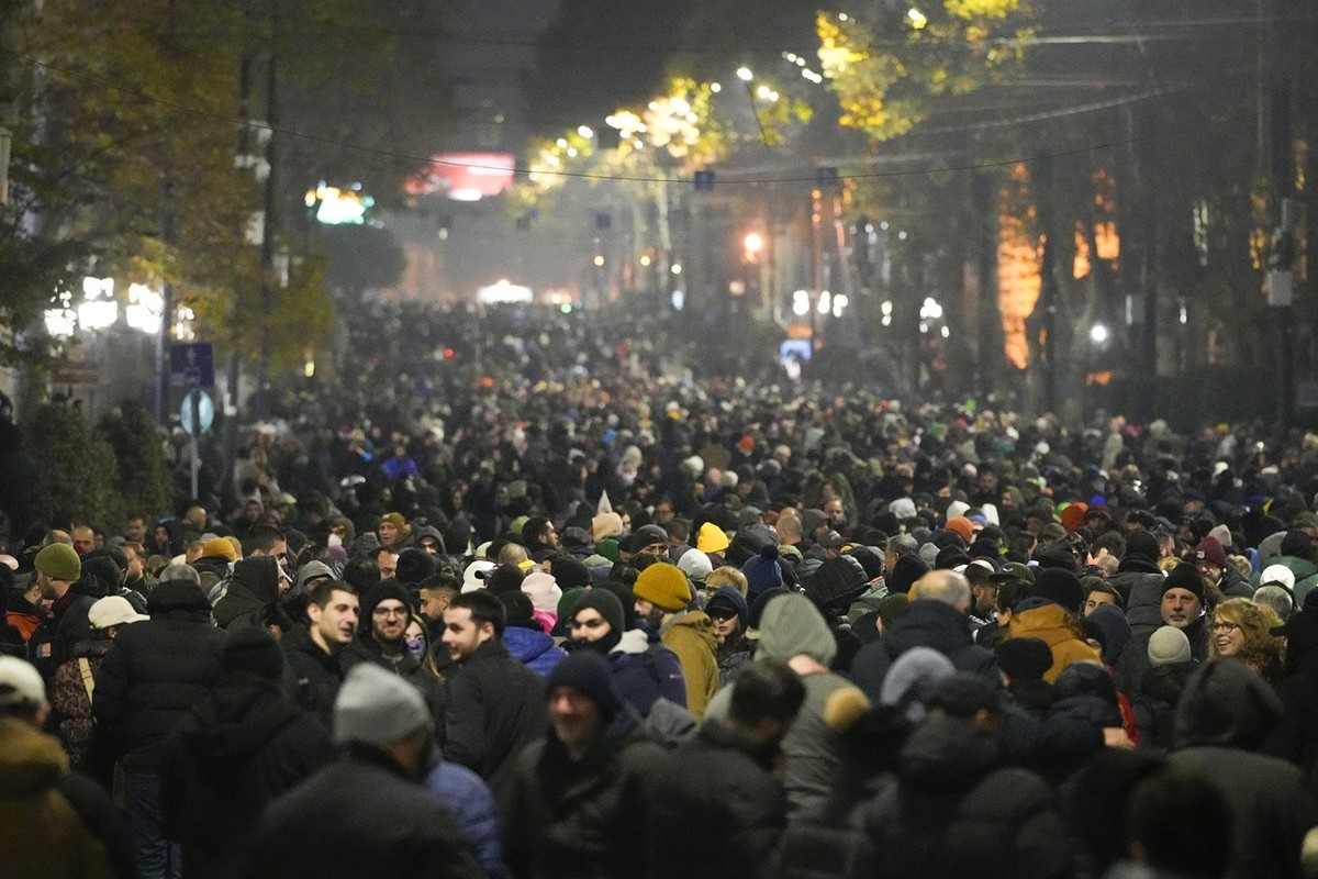 Demonstrators rally outside the parliament to protest against the government's decision to suspend negotiations on joining the European Union in Tbilisi, Georgia, Sunday, Dec. 8, 2024. (AP Photo/ ...