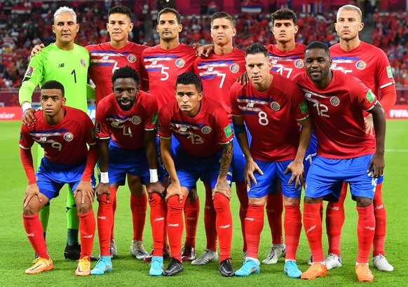 epa10254004 Players of Costa Rica line up for the FIFA World Cup 2022 Intercontinental playoff qualifying soccer match between Costa Rica and New Zealand in Al Rayyan, Qatar, 14 June 2022. Back from L ...