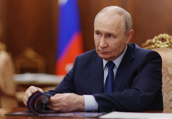 Russian President Vladimir Putin attends a meeting with Deputy Prime Minister - Presidential Envoy to the Far Eastern Federal District Yury Trutnev at the Kremlin in Moscow, Thursday, Aug. 6, 2026. (A ...