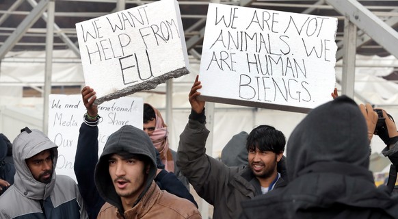 epa08914443 Migrants Protest against poor living conditions at Camp Lipa in Bihac, Bosnia and Herzegovina, 01 January 2021. Some thousand refugees at the camp were scheduled to be relocated from the b ...