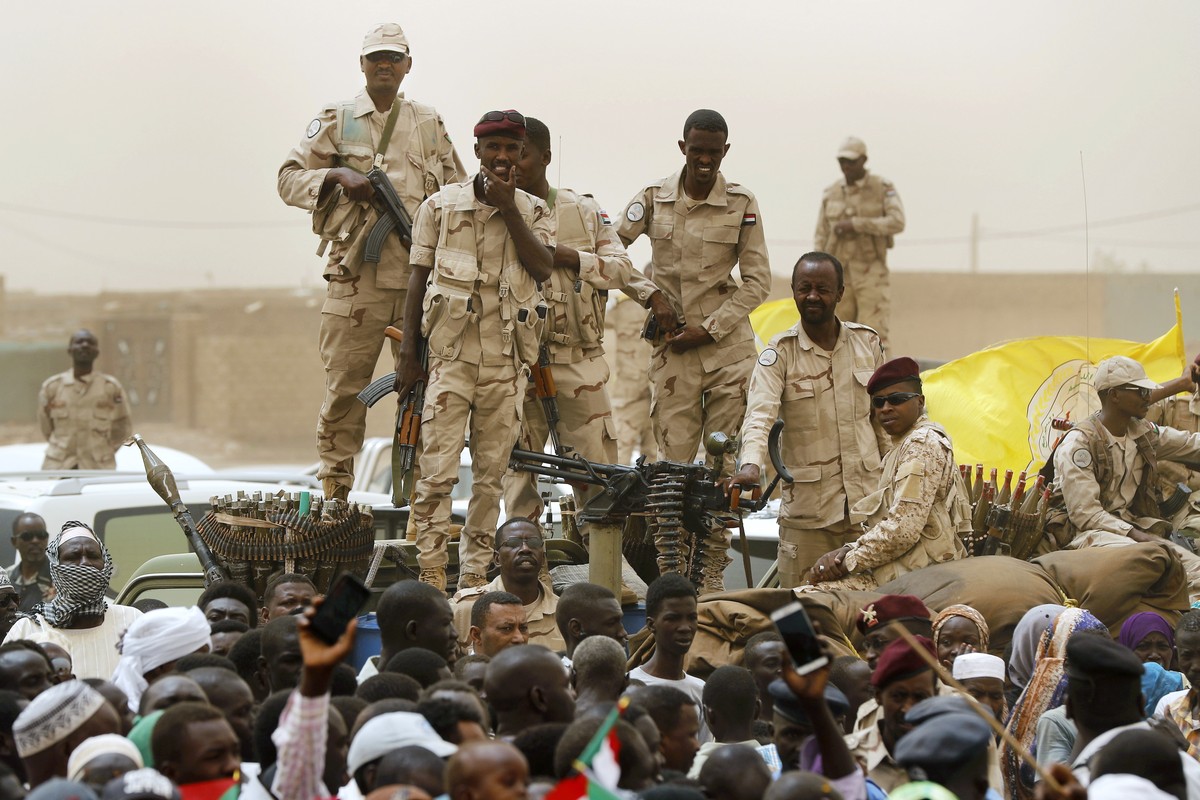 Sudanese soldiers from the Rapid Support Forces unit stand on their vehicle during a military-backed rally, in Mayo district, south of Khartoum, Sudan, Saturday, June 29, 2019. The United States impos ...