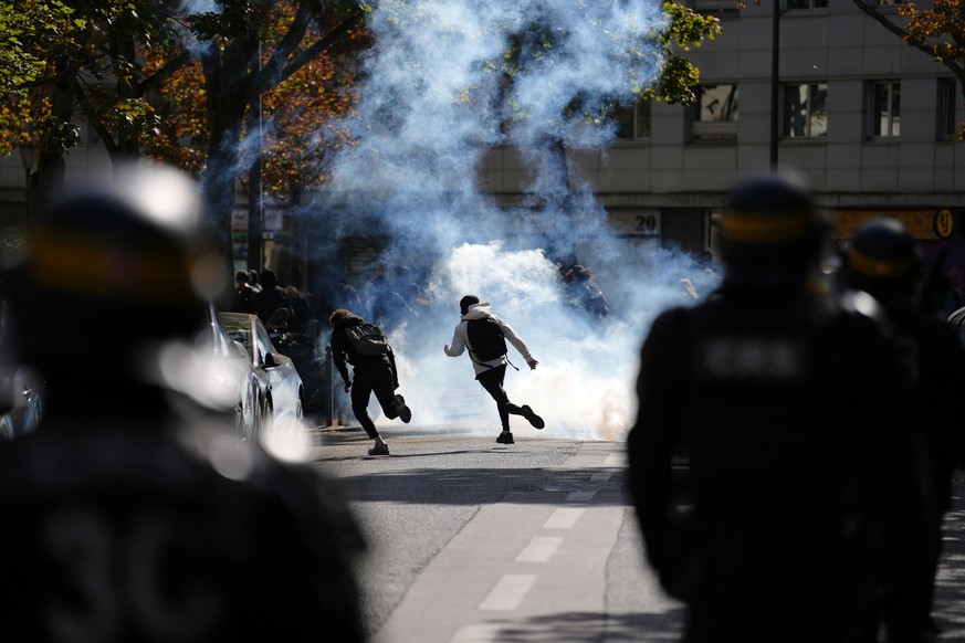 Students run through teargas as they face policemen during a protest against under-resourced schools, in Paris, Friday, Oct. 2, 2026. (AP Photo/Aurelien Morissard)
France Protests