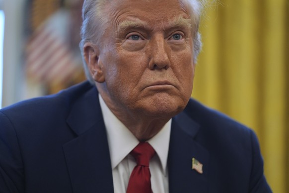 President Donald Trump listens to a question as he signs executive orders in the Oval Office at the White House, Thursday, Jan. 30, 2025, in Washington. (AP Photo/Evan Vucci)
Donald Trump