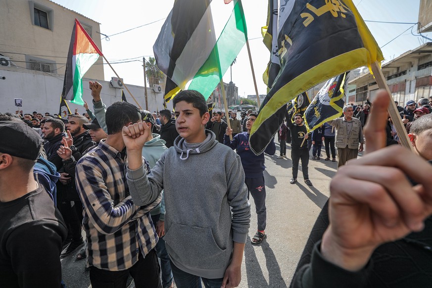 epa10434281 Palestinians attend a protest in Jenin camp after nine Palestinians died during a raid by Israeli forces in the West Bank, in Gaza City, 27 January 2023. EPA/MOHAMMED SABER