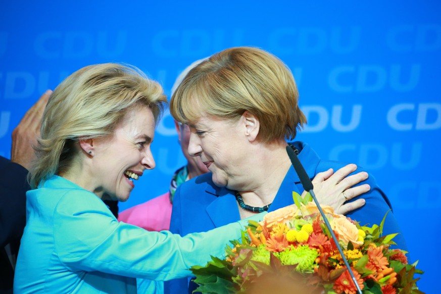 epa07691562 (FILE) - German Chancellor Angela Merkel (R) and Federal Minister of Labour and Social Affairs Ursula von der Leyen react to first results of the German federal elections at CDU party head ...