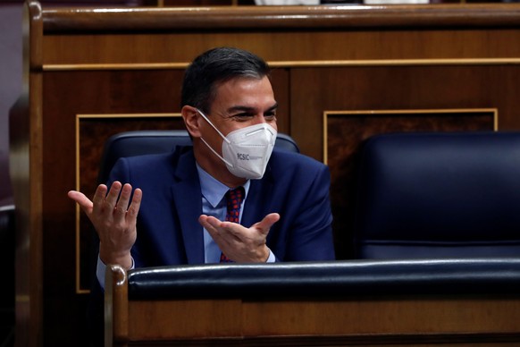 epa08887073 Spanish Prime Minister, Pedro Sanchez, reacts during a Parliamentary session at the Lower House in Madrid, Spain, 16 December 2020, where Sanchez is to inform about the two last EU Council ...
