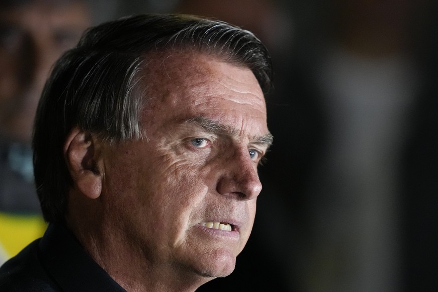 Brazilian President Jair Bolsonaro, who is running for another term, gestures during a press conference after general election polls closed in in Brasilia, Brazil, Sunday, Oct. 2, 2022. (AP Photo/Eral ...