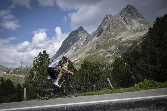 Juan Ayuso from Spain of UAE Team Emirates climbs the Albula pass to win the fifth stage, a 211 km race from Fiesch to La Punt, at the 86th Tour de Suisse UCI World Tour cycling race, on Thursday, Jun ...