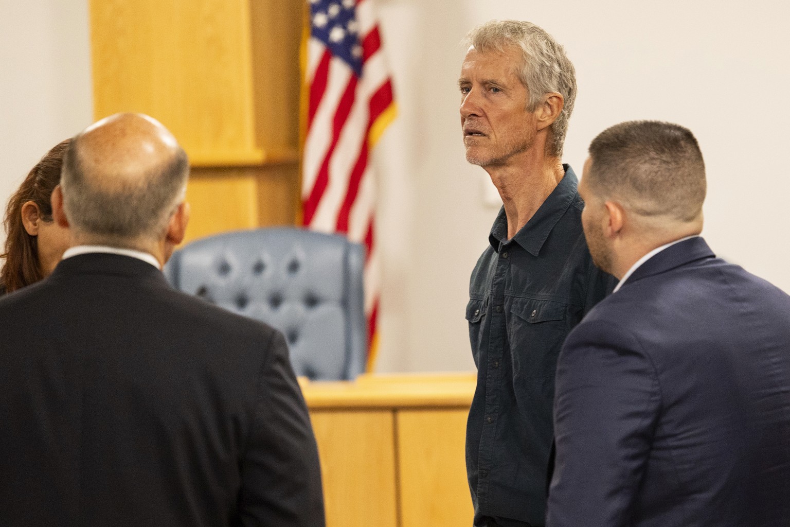 Tym Catterson, second from right, a contractor for OceanGate, talks to family members from the Titan tragedy after his testimony ended in a Coast Guard investigatory hearing on the causes of the implo ...