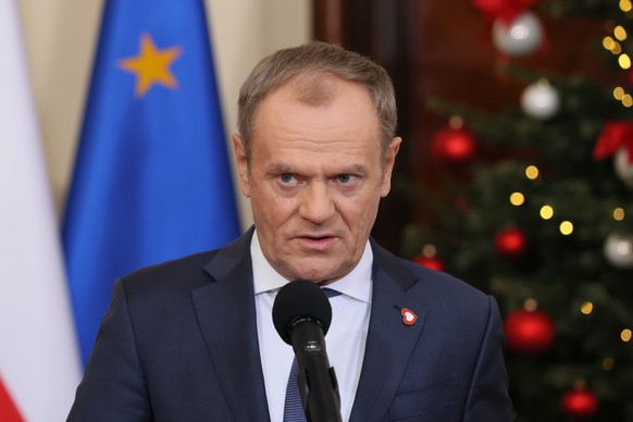 epa11037068 Polish Prime Minister Donald Tusk speaks during a press conference after the first meeting of his cabinet at the Prime Minister's Office in Warsaw, Poland, December 19, 2023. The new Polish government...