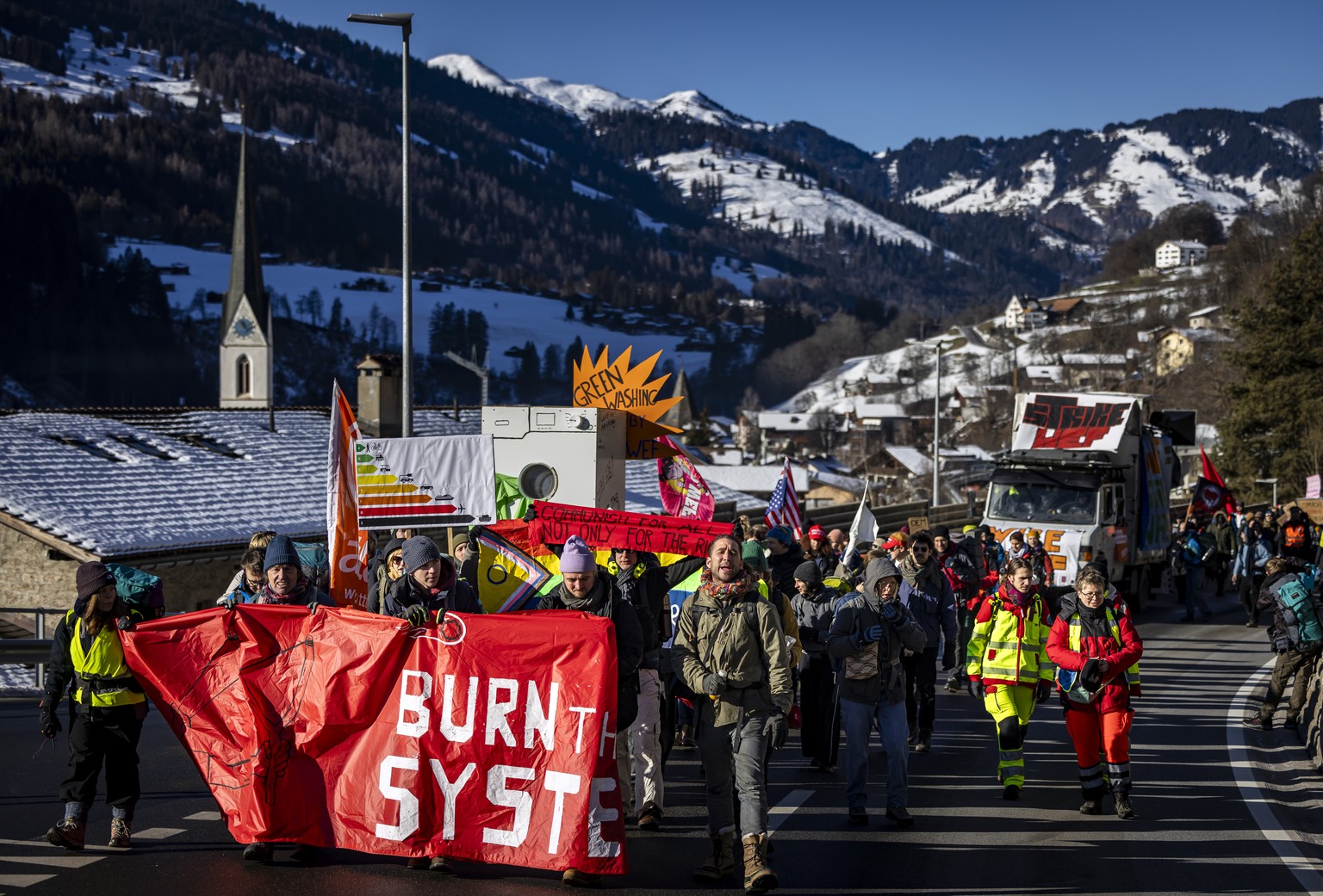 Protestors hike during a demonstration of the collective &#039;Strike WEF&#039; before the annual meeting of the World Economic Forum, WEF, in Kueblis, Switzerland, on Saturday, January 18, 2025. The  ...