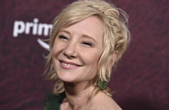 FILE - Anne Heche arrives at the premiere of &quot;The Tender Bar&quot; on Dec. 12, 2021, at the TCL Chinese Theatre in Los Angeles. Heche was in the hospital Saturday, Aug. 6, 2022, following an acci ...