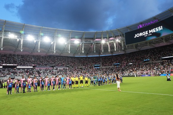 Teams for Inter Miami and Monterrey stand for a moment of silence in memory of Jorge Messi, the late father of Inter Miami forward Lionel Messi, during the first half of a Leagues Cup soccer match, Sa ...