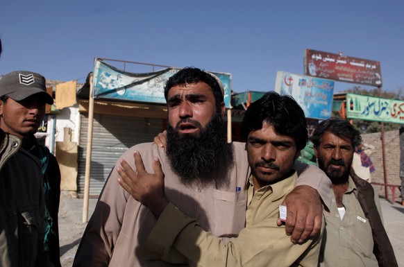 Relatives of police cadets wait for word outside the Police Training Center after an attack on the center in Quetta, Pakistan October 25, 2016. REUTERS/Naseer Ahmed