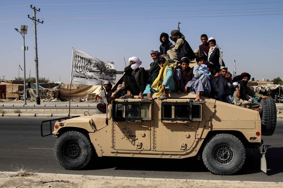 epa09440668 Taliban forces rally to celebrate the withdrawal of US forces in Kandahar, Afghanistan, 01 September 2021. The Taliban called for support from the international community to revive an econ ...