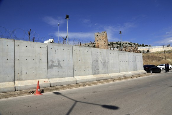 FILE - This May 24, 2017 file photo shows the newly built wall near Cilvegozu border gate in Reyhanli, at the Turkey-Syria border. Within a two-week span, Turkey&#039;s president has caused a stir by  ...