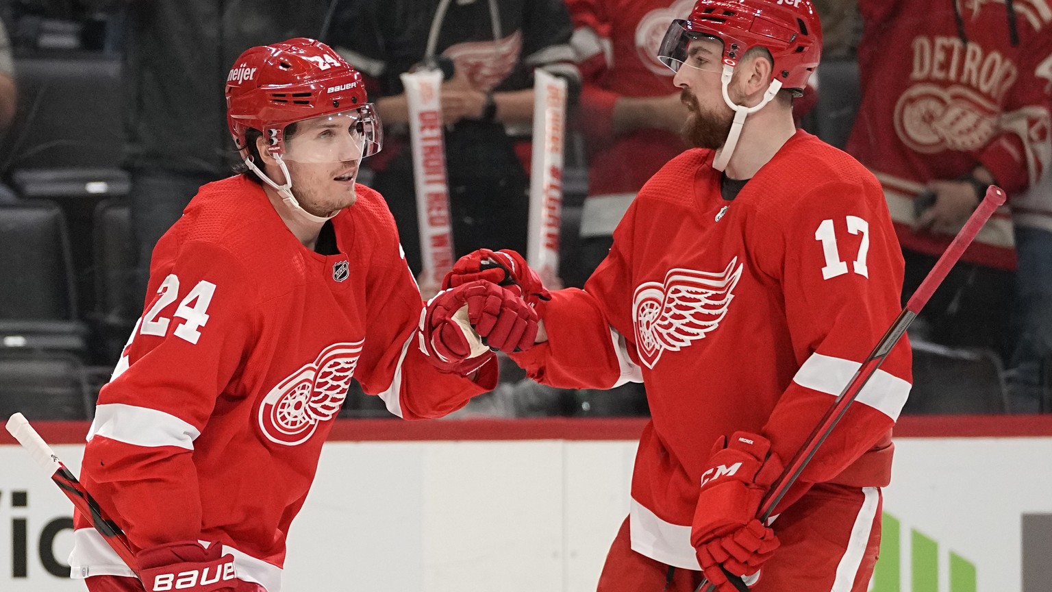 Detroit Red Wings center Pius Suter (24) celebrates his goal with Filip Hronek (17) against the San Jose Sharks in the second period of an NHL hockey game Tuesday, Jan. 4, 2022, in Detroit. (AP Photo/ ...