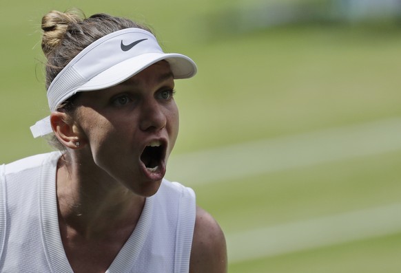 Romania&#039;s Simona Halep celebrates winning a point against Ukraine&#039;s Elina Svitolina in a Women&#039;s semifinal singles match on day ten of the Wimbledon Tennis Championships in London, Thur ...