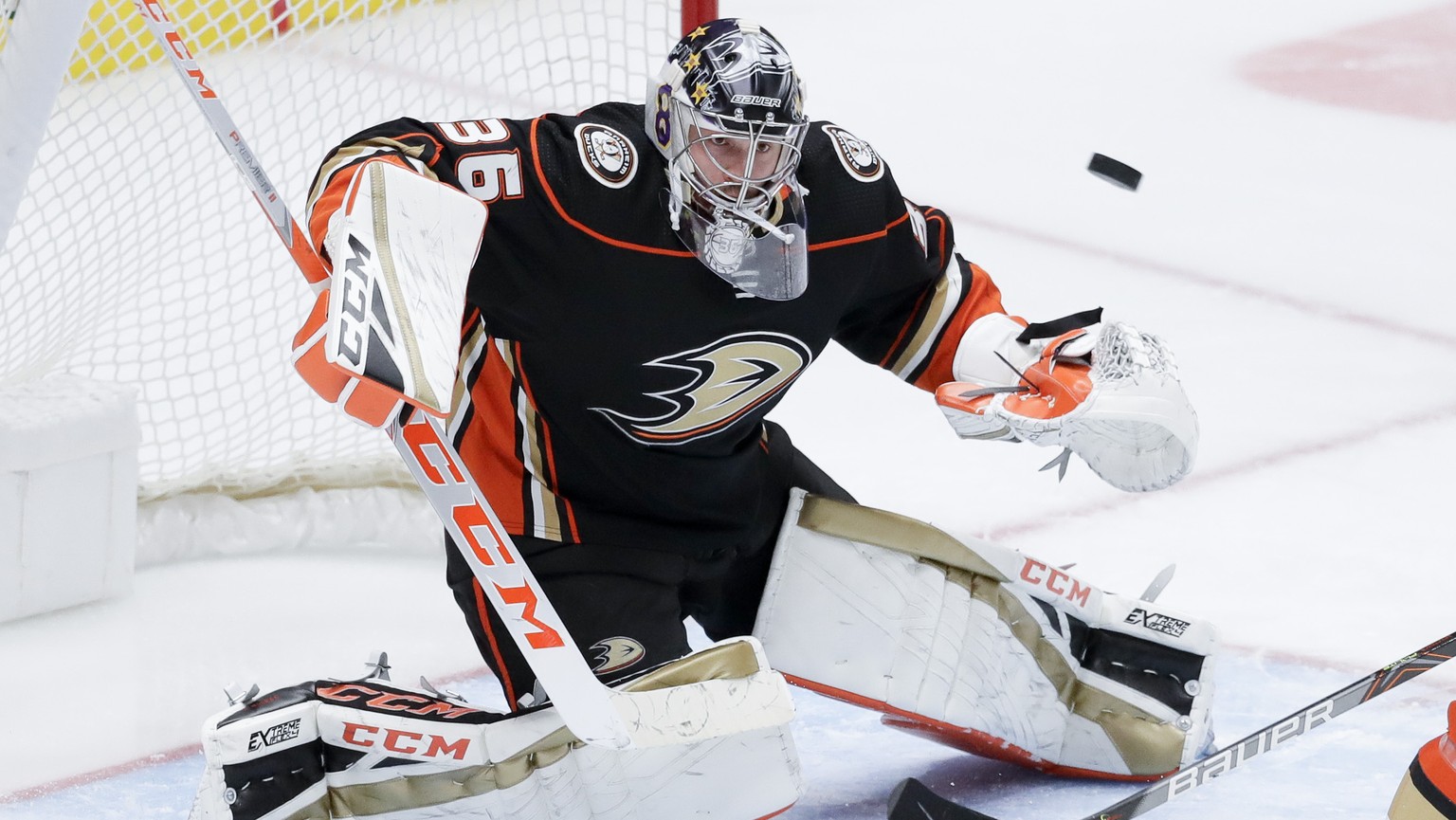 FILE - Anaheim Ducks goaltender John Gibson blocks a shot during the third period of an NHL hockey game against the Vegas Golden Knights in Anaheim, Calif., in this Sunday, Feb. 23, 2020, file photo. ...