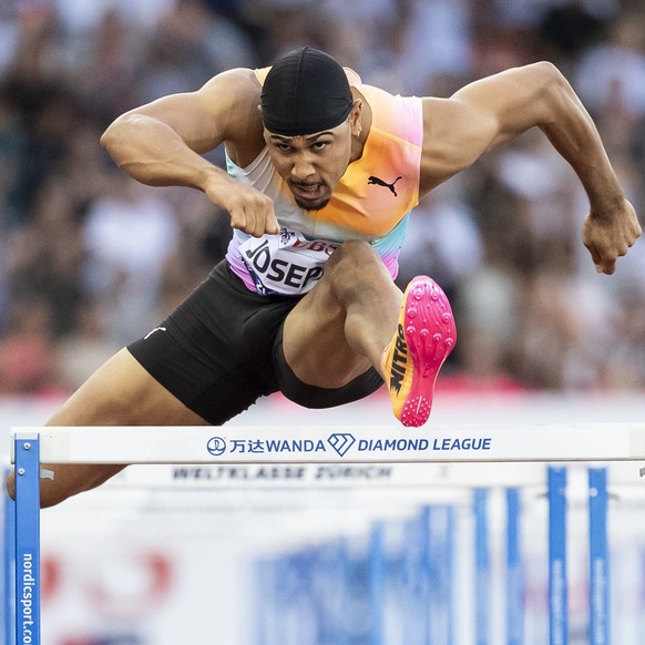 epa13195063 First placed Jason Joseph of Switzerland competes in the 110m Hurdles Men final at the World Athletics Diamond League athletics meeting at the Letzigrund stadium in Zurich, Switzerland, 27 ...