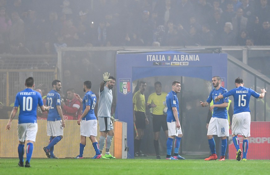 Football Soccer - Italy v Albania - World Cup 2018 Qualifiers - Group G - Renzo Barbera stadium, Palermo, Italy - 24/3/17. Italy&#039;s players leave the pitch as the referee suspends the match after  ...