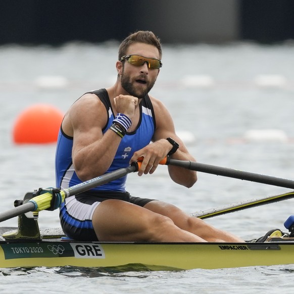 Stefanos Ntouskos of Greece reacts after winning the gold medal in the men&#039;s rowing single sculls final at the 2020 Summer Olympics, Friday, July 30, 2021, in Tokyo, Japan. (AP Photo/Darron Cummi ...