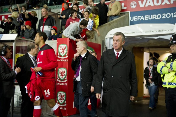 Coach Ottmar Hitzfeld, of Switzerland, third right, during the Euro 2012 group G qualification soccer match between Switzerland and Wales at the Liberty Stadium in Swansea, Friday, October 7, 2011. (K ...