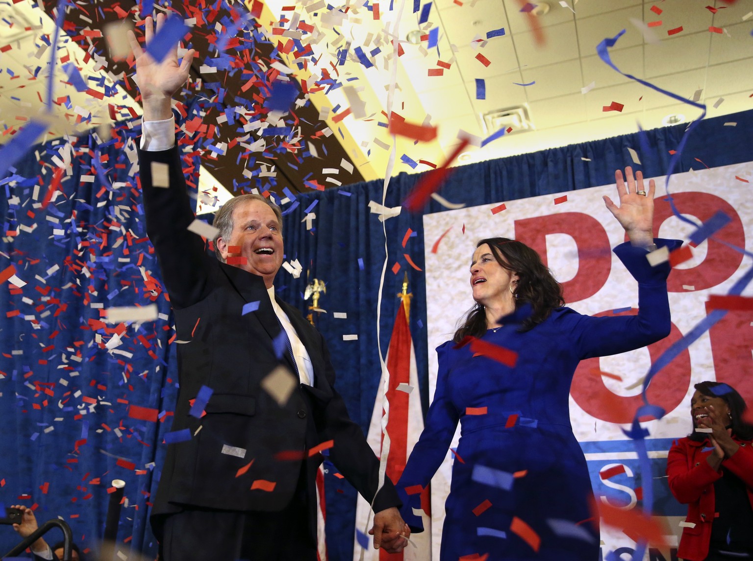 Democratic candidate for U.S. Senate Doug Jones and his wife Louise wave to supporters before speaking Tuesday, Dec. 12, 2017, in Birmingham, Ala. Jones has defeated Republican Roy Moore, a one-time G ...