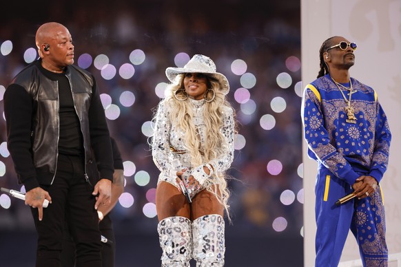 epa09754348 (L-R) Dr. Dre, Mary J. Blige and Snoop Dogg during the halftime show of Super Bowl LVI at SoFi Stadium in Inglewood, California, USA, 13 February 2022. The annual Super Bowl is the Champio ...