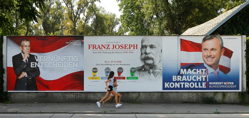 An exhibition advertisement on the occasion of the 100th anniversary of the death of former Austrian Emperor Franz Joseph is seen betweeen presidential election campaign posters of Alexander Van der B ...